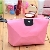 ✪韓版水餃形糖果色化妝包可愛飾品包元寶形果凍包防水洗漱包收納盒 特價：$86